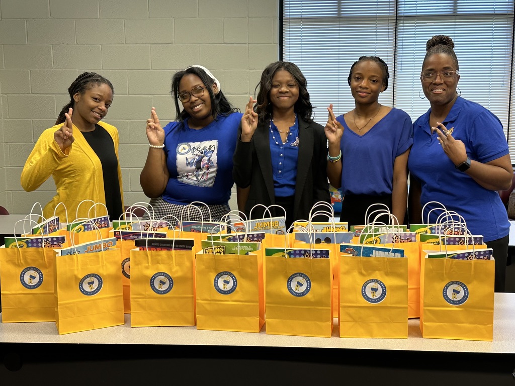Haley and fellow Rhoer Club members with bags of community service supplies